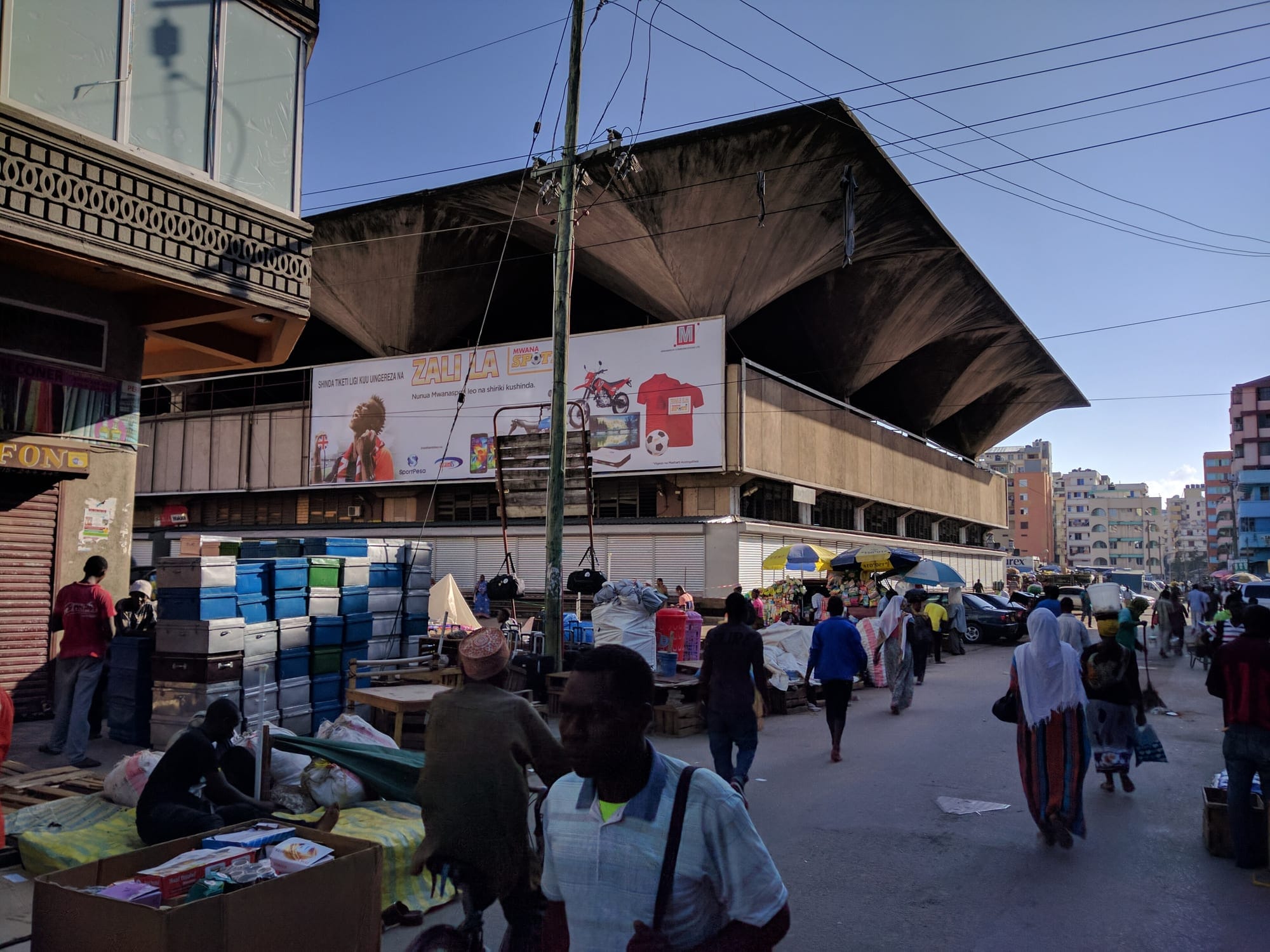 Traders and shoppers on the street outside Kariakoo market in the morning